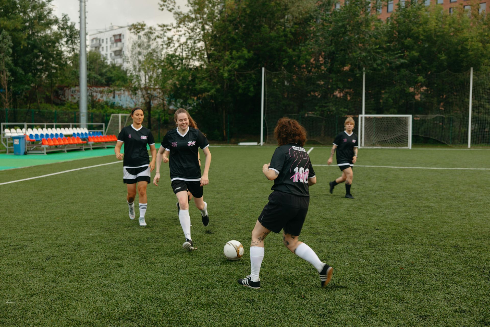 A group of young athletes playing soccer.