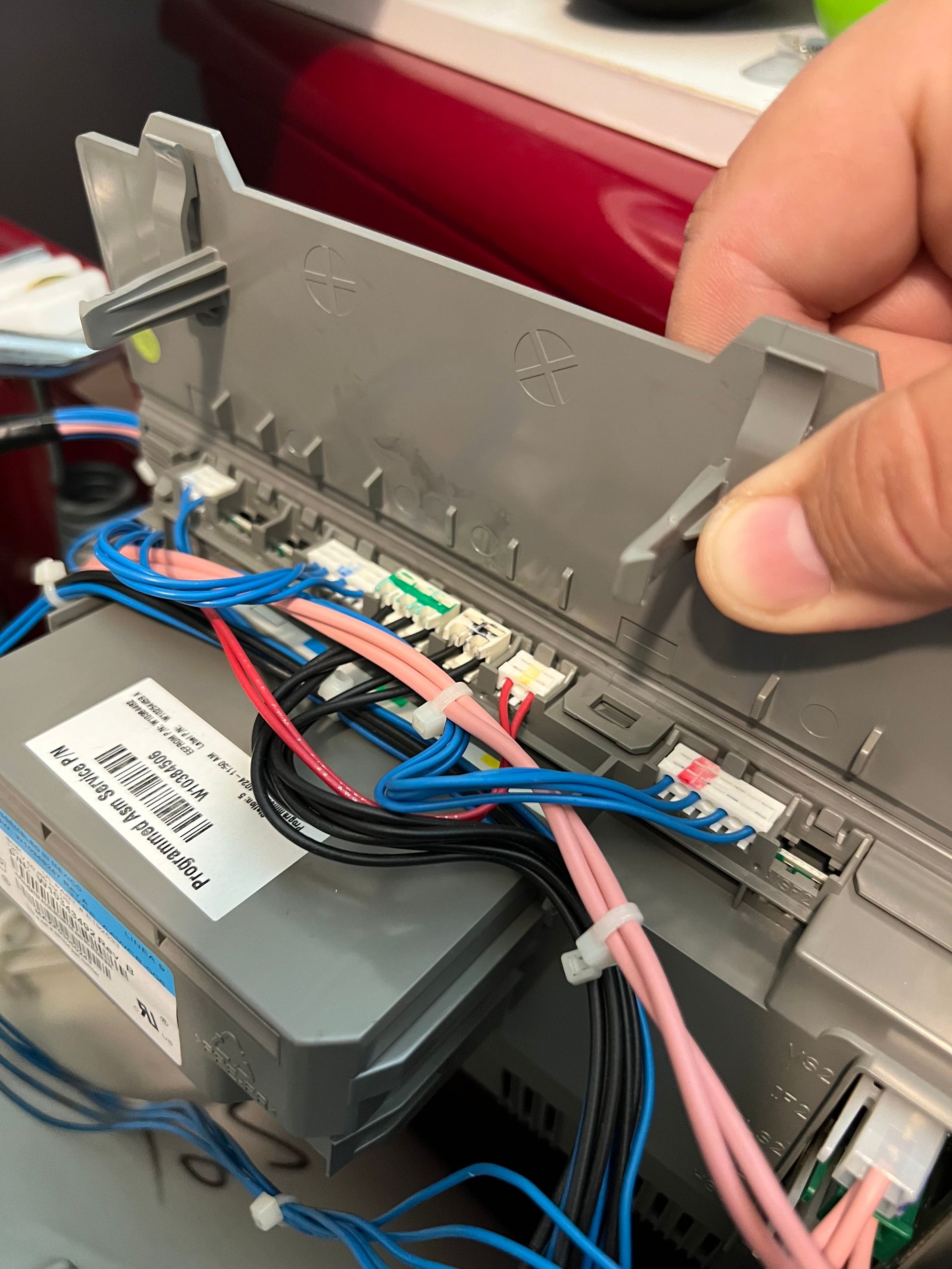 A close up of a person working on a machine