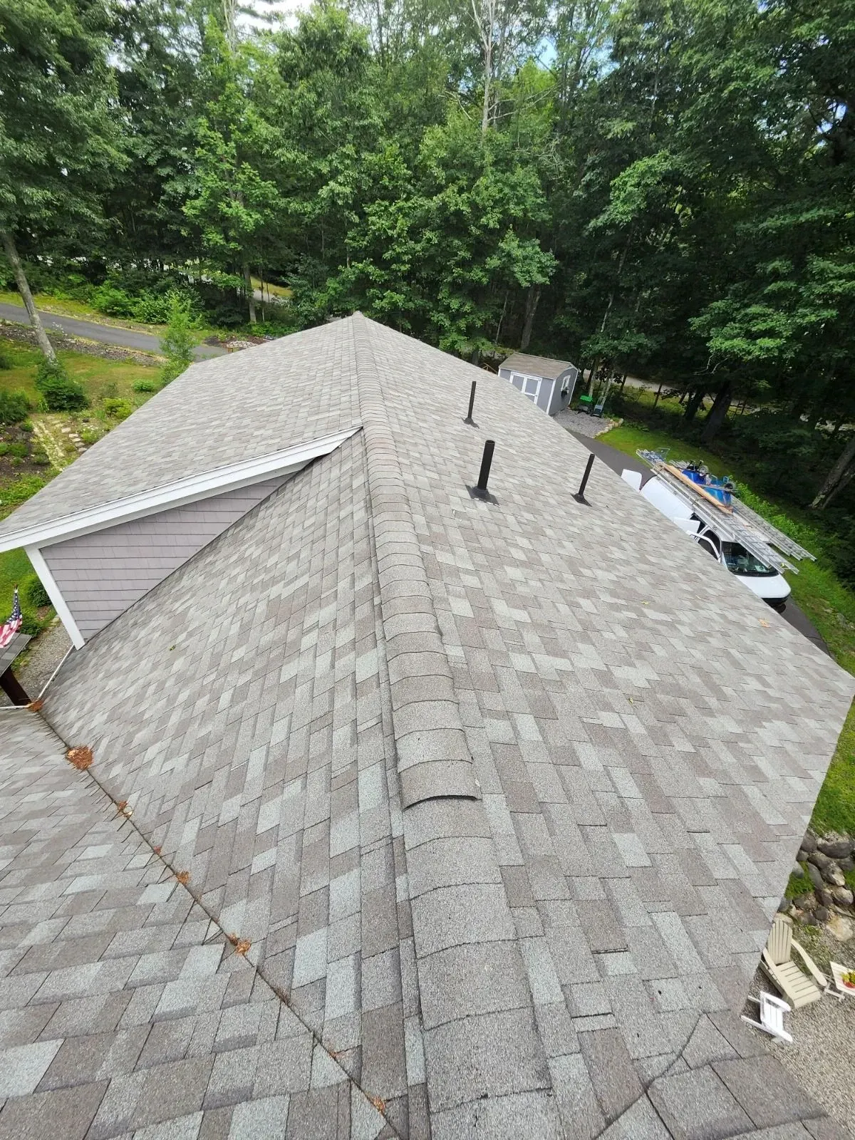 An aerial view of a roof with shingles on it.