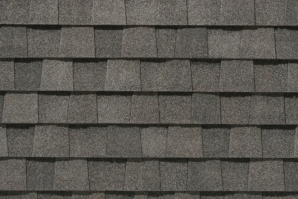 A close up of a roof with shingles on it.