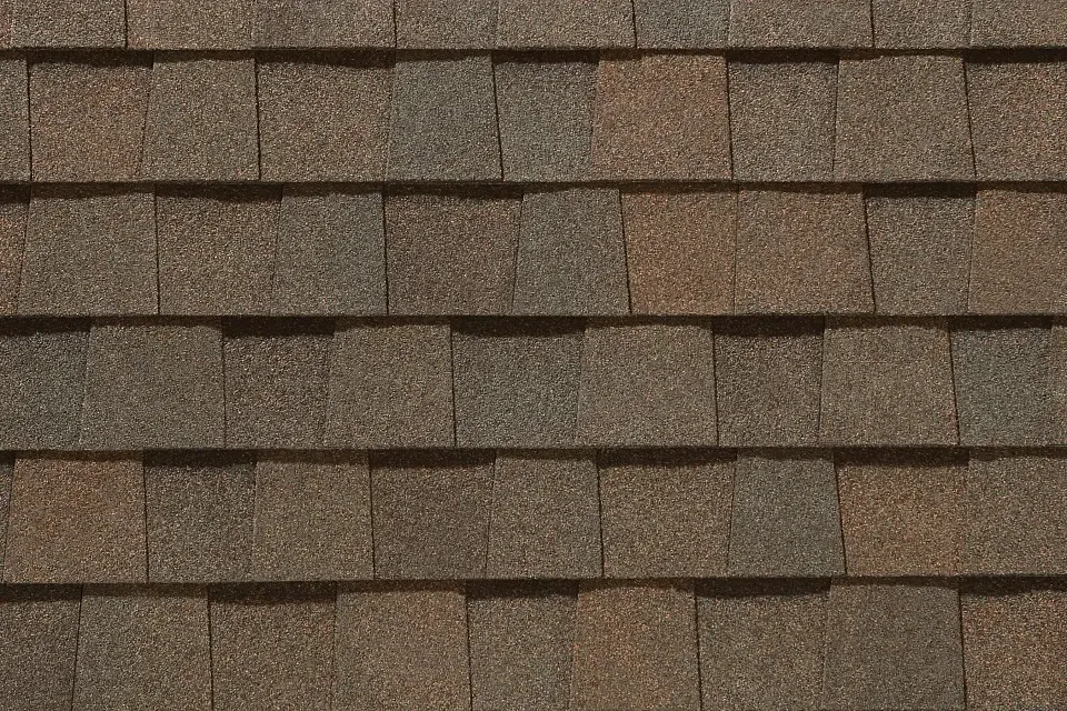 A close up of a roof with shingles on it.