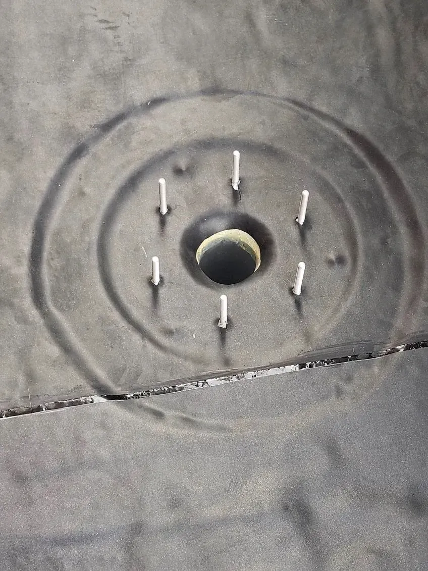 A close up of a tire with a hole in the middle.