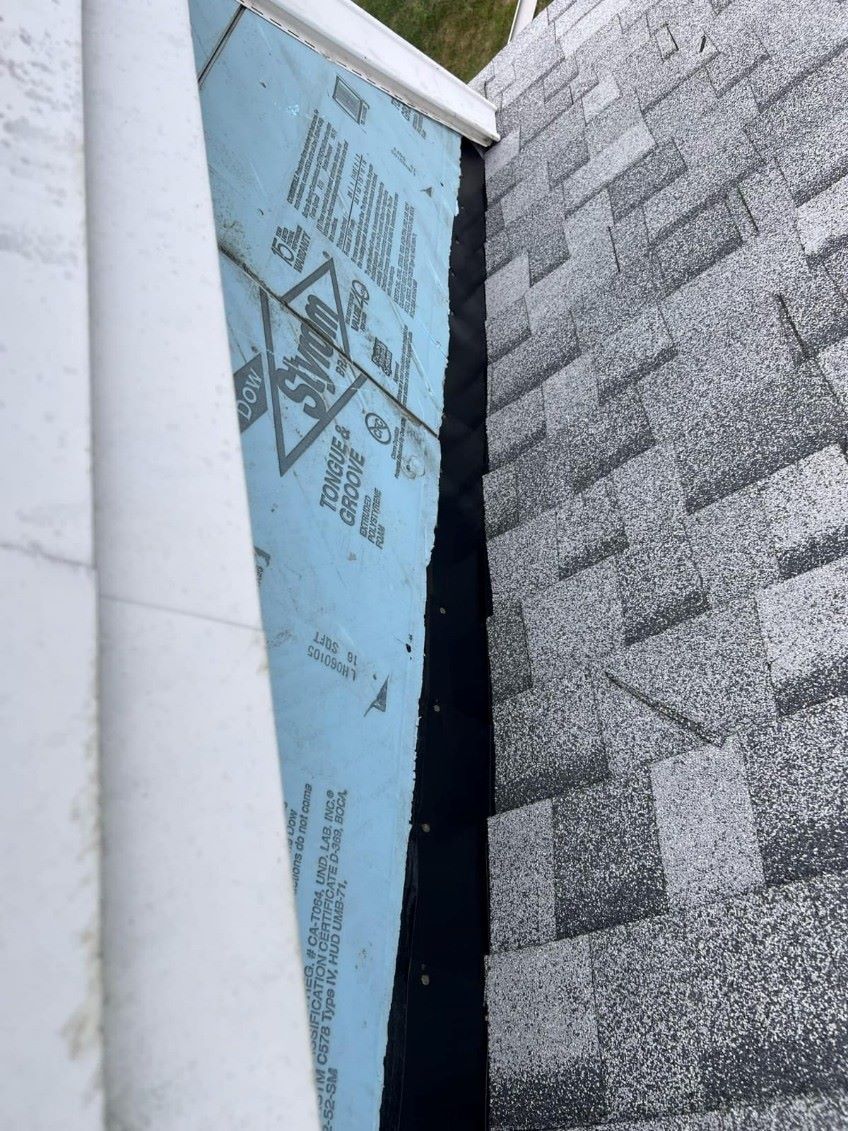 A roof with a piece of blue foam on it