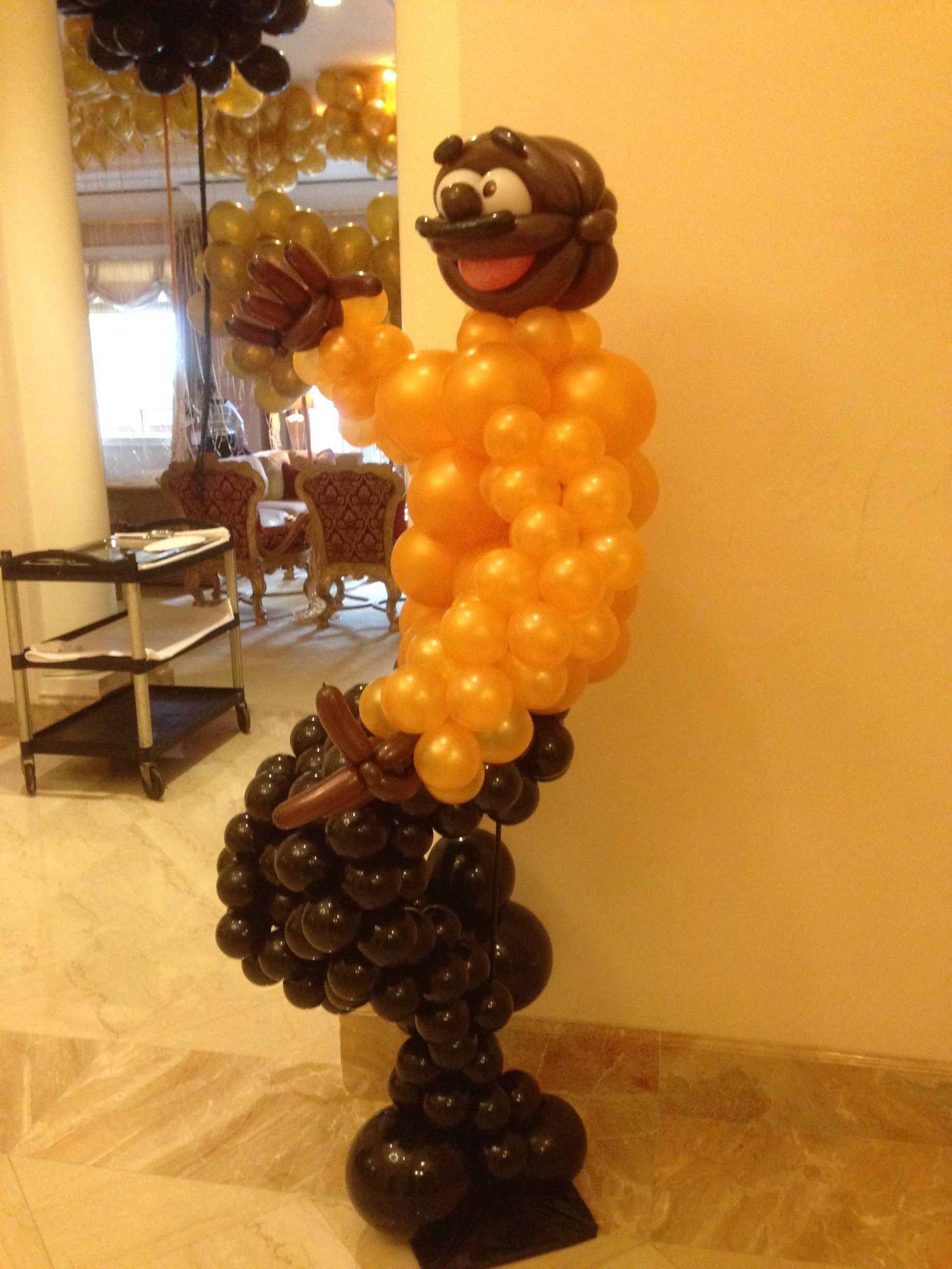 man sculpture made of balloons