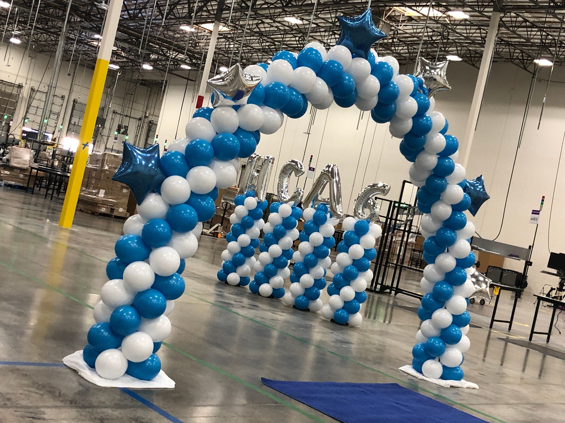Classic Balloon Arch made of blue and white balloons for Amazon event