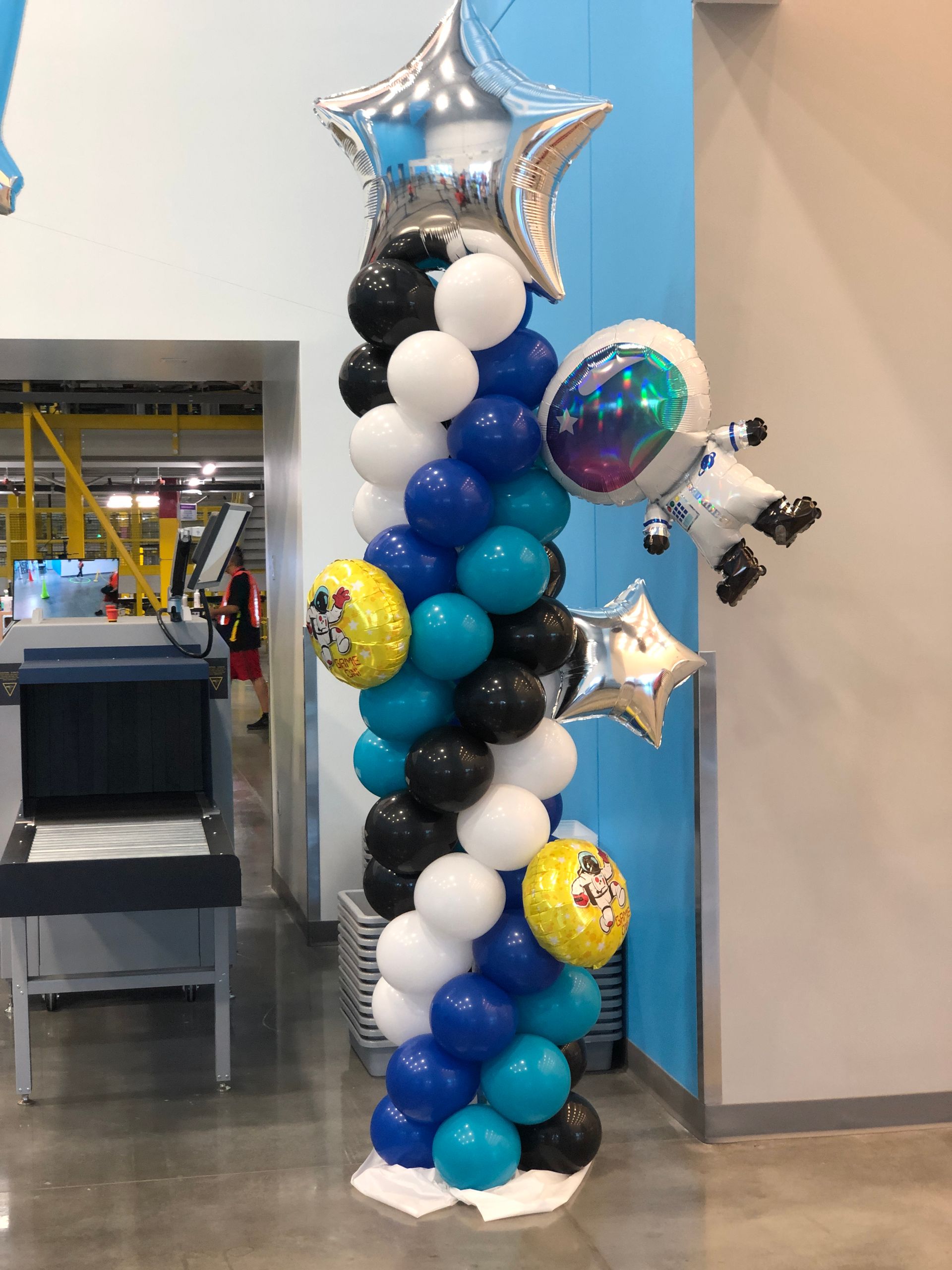A tower made of balloons with a space theme