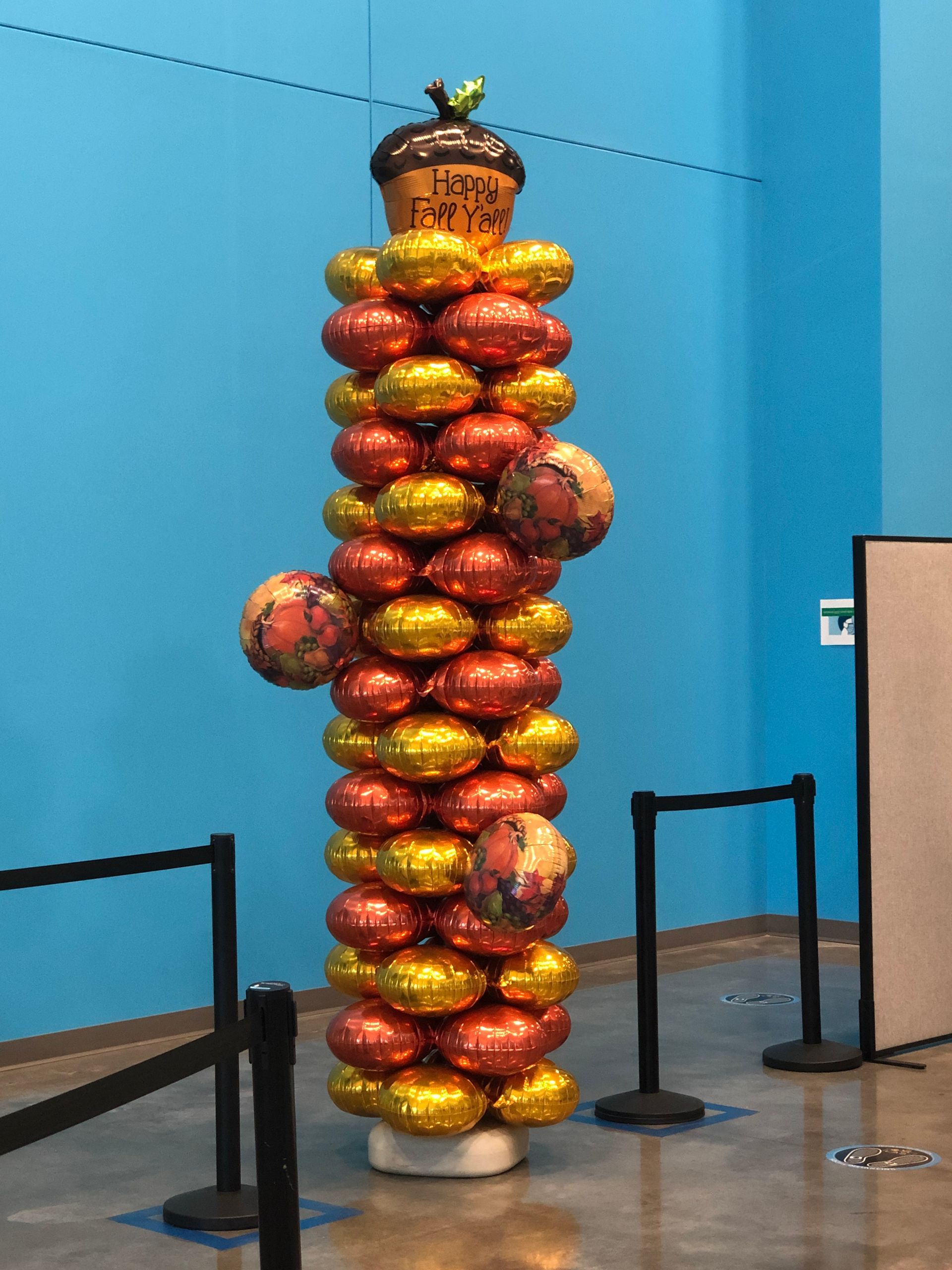 A bunch of balloons are stacked on top of each other