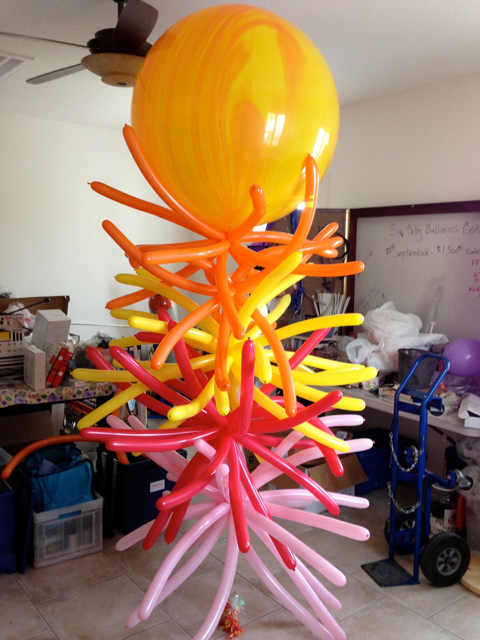 A bunch of balloons are stacked on top of each other