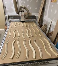 pieces of custom cut curved molding