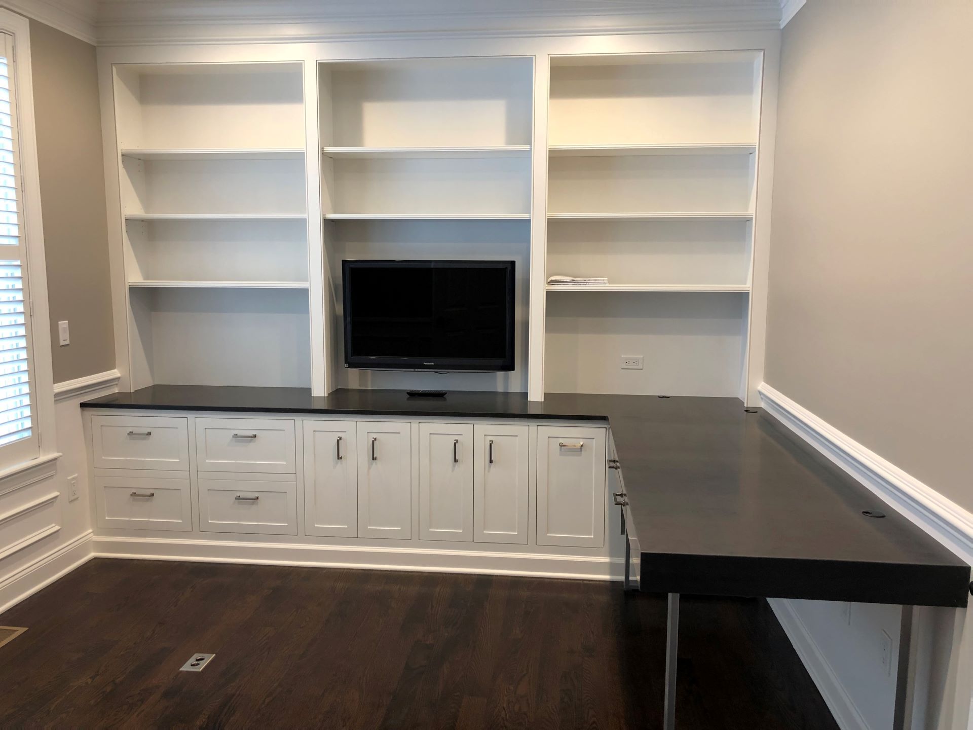 custom bookcase, storage and desk in a study