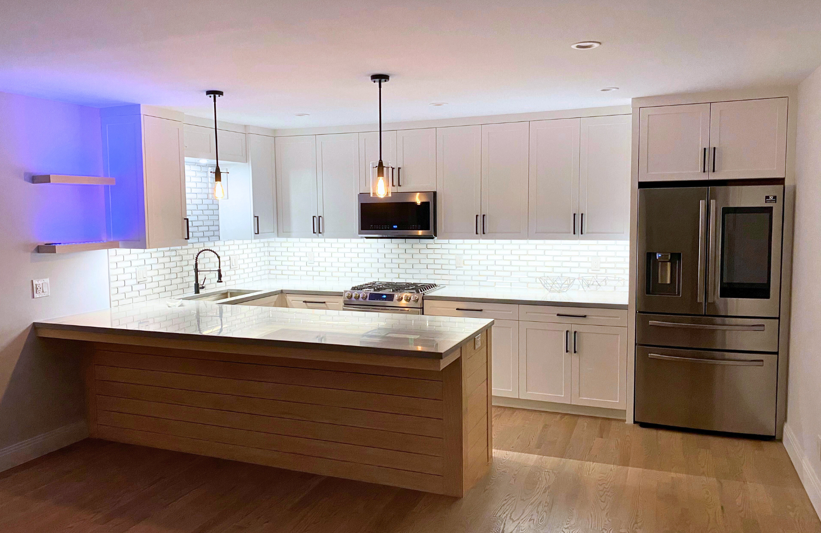 white cabinets with white and blue LED lighting underneath