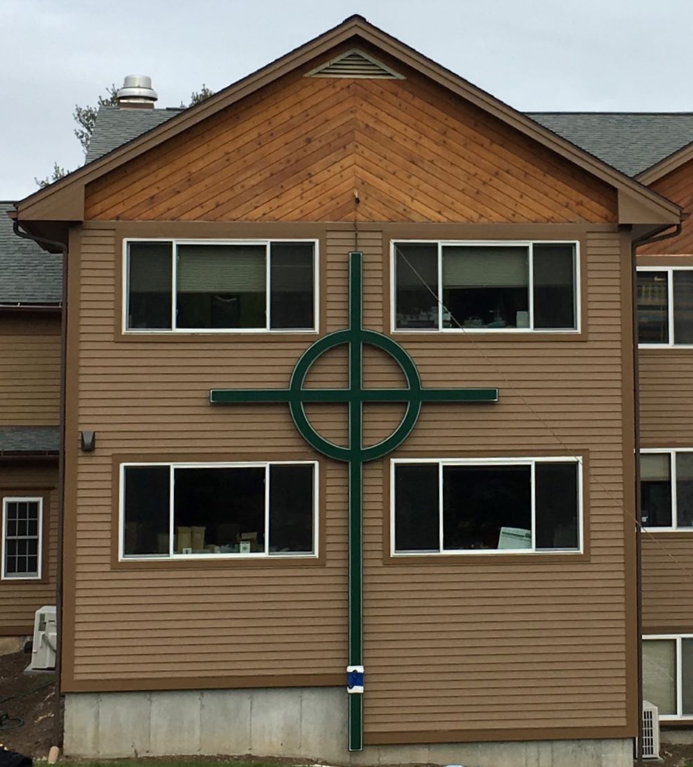 Church office building with custom built light up cross on the exterior