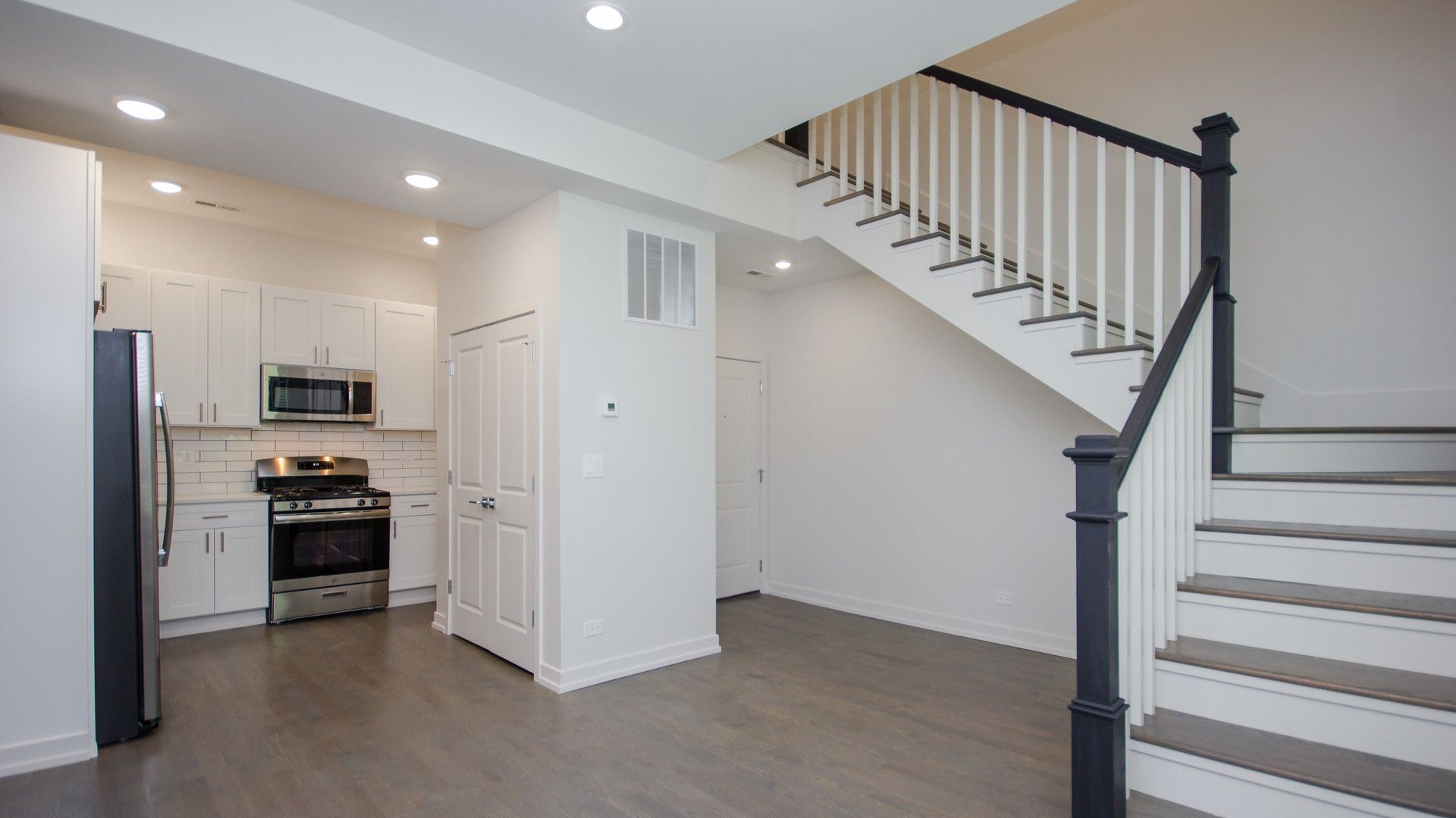 Kitchen and living with staircase