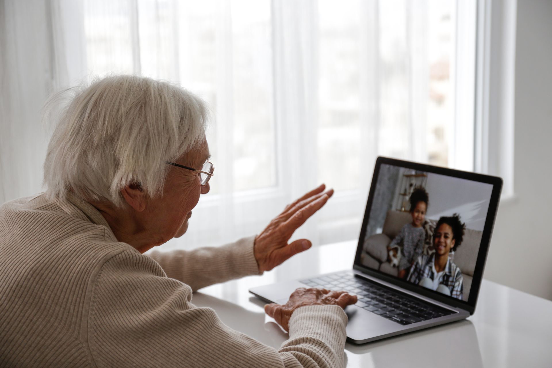 elderly person on video call with family