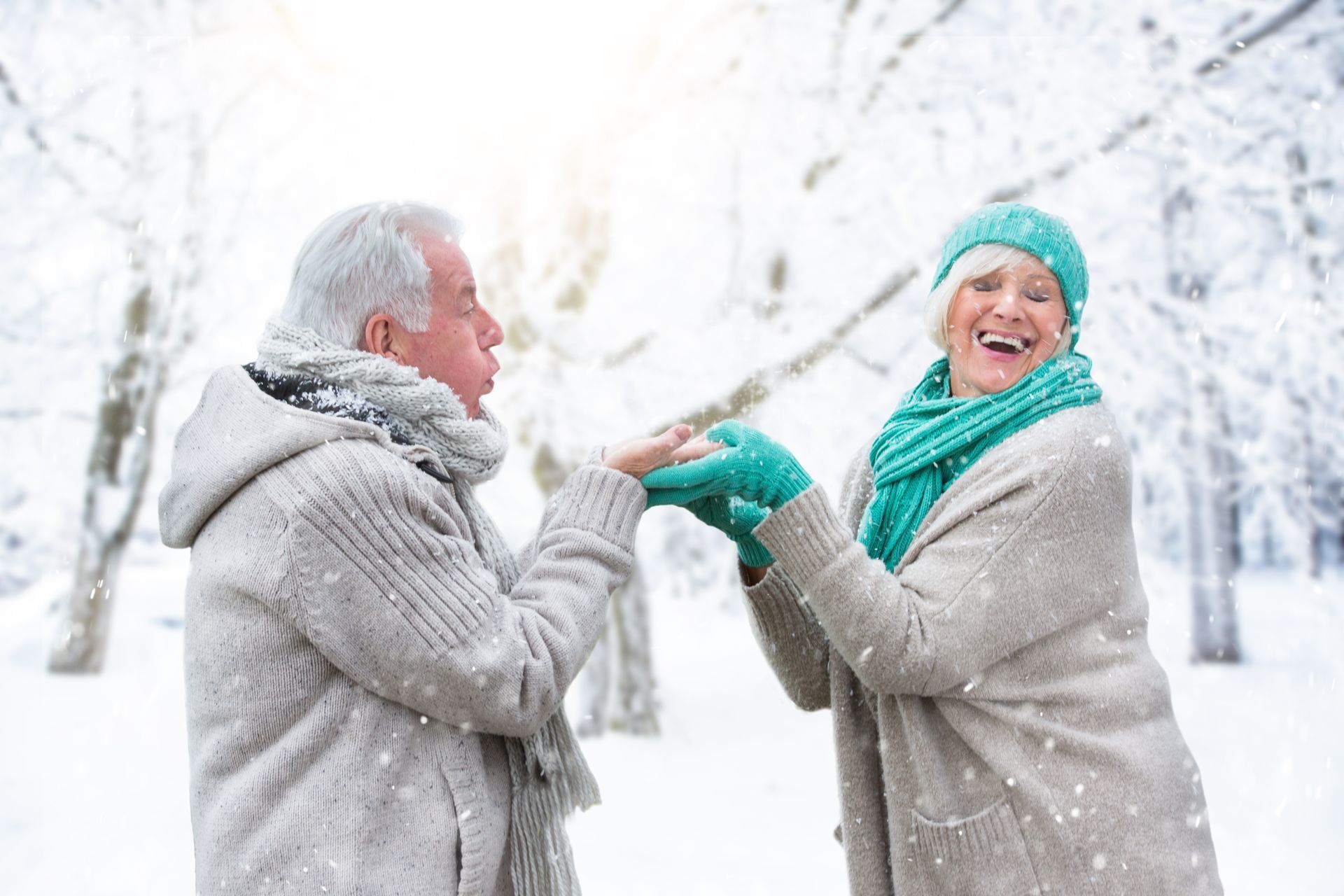 elderly couple having fun in the snow