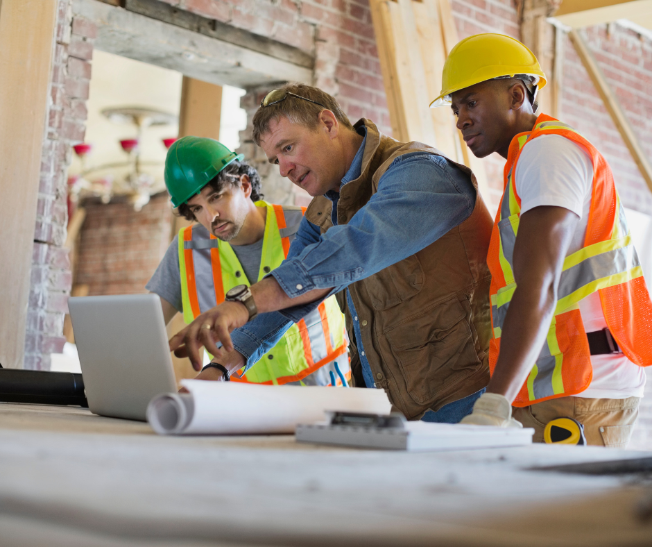 Close-up of climbing gear: carabiners, ropes, and harnesses hanging on a wooden wall.