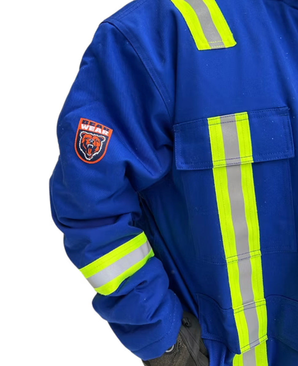 Blue work coverall with reflective stripes and a logo on the sleeve.