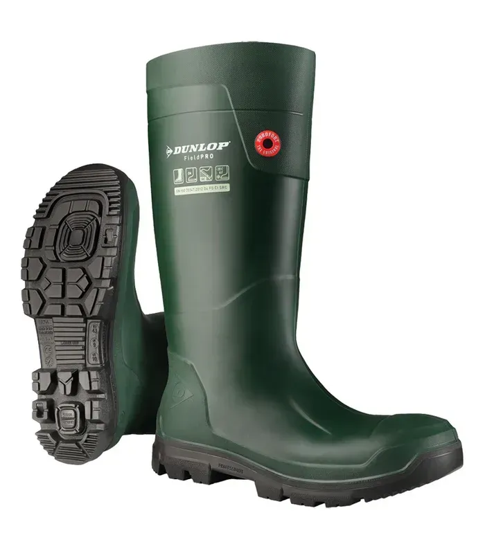 Green Dunlop wellington boots with black soles, one showing tread.