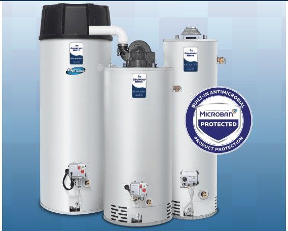 Three white water heaters are sitting next to each other on a blue background.