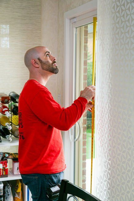 Man Measuring The Glass — Palatine, IL —  Sliding Door & Window