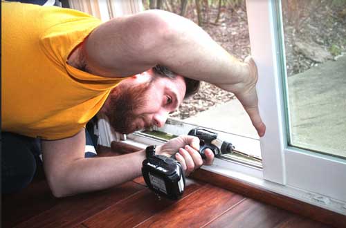Man Replacing Glass — Palatine, IL — Sliding Door & Window