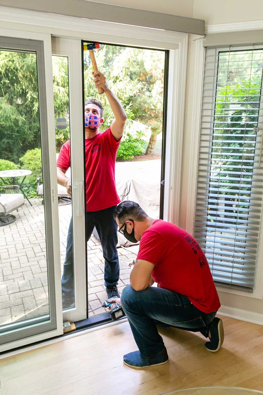Two Man Fixing The Head And Sill Of Sliding Door — Palatine, IL —  Sliding Door & Window