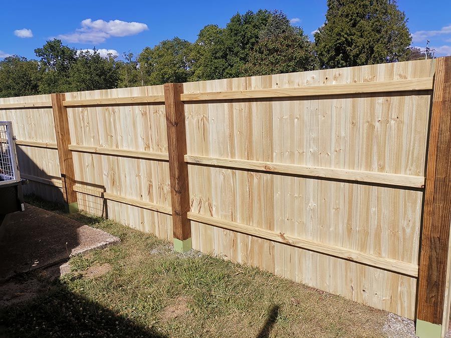 A Wooden Fence is Sitting on Top of a Lush Green Field — WeFence in Lisarow, NSW