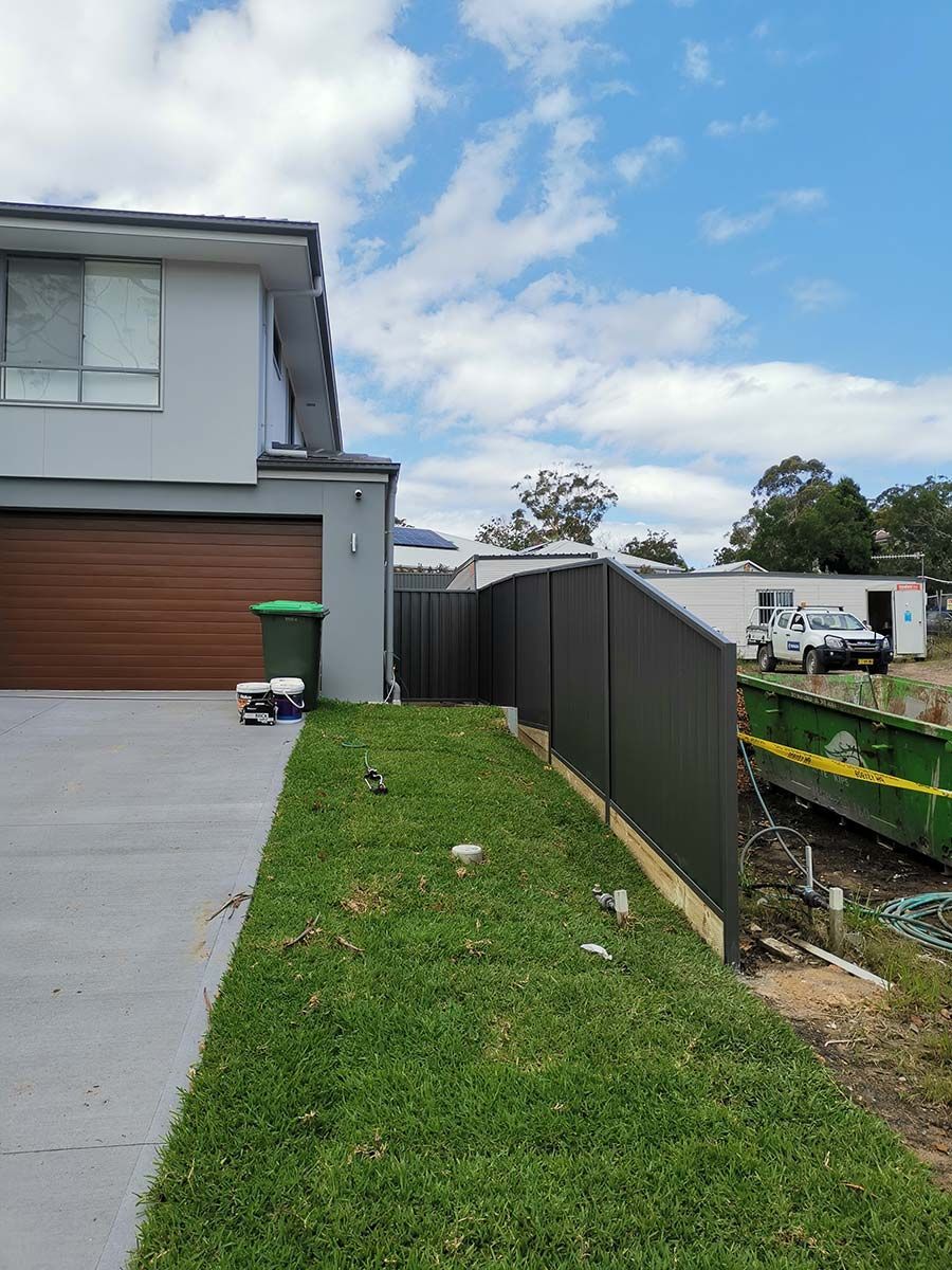 A House With a Garage and a Fence in Front of It — WeFence in Lisarow, NSW