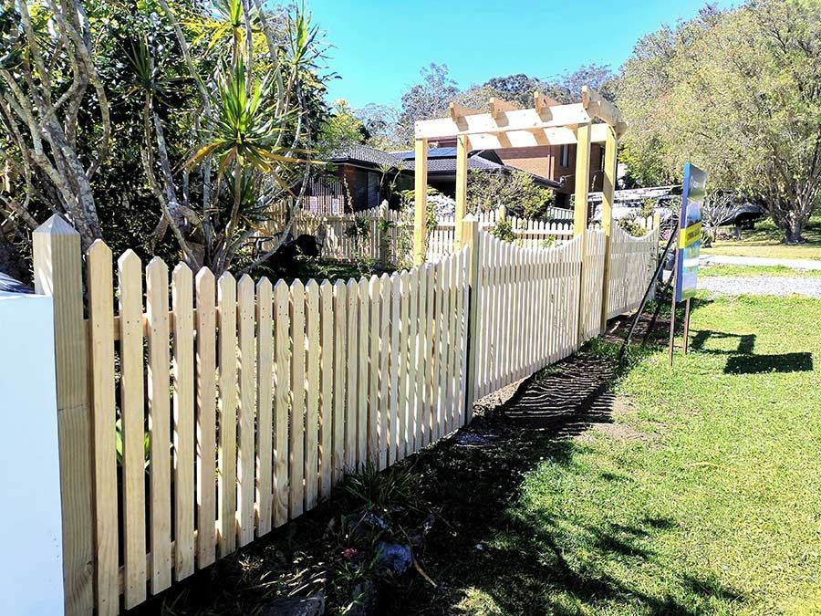 A white railing on a porch with a table and chairs behind it — WeFence in Lisarow, NSW