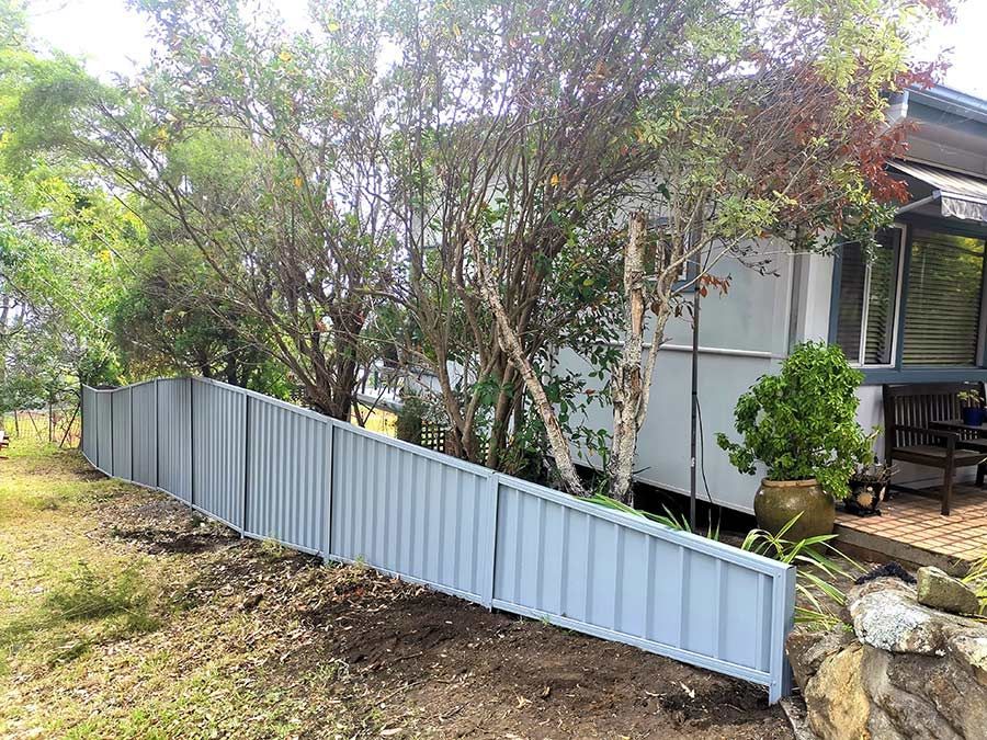 A White House With a Fence and Trees in Front of It — WeFence in Lisarow, NSW