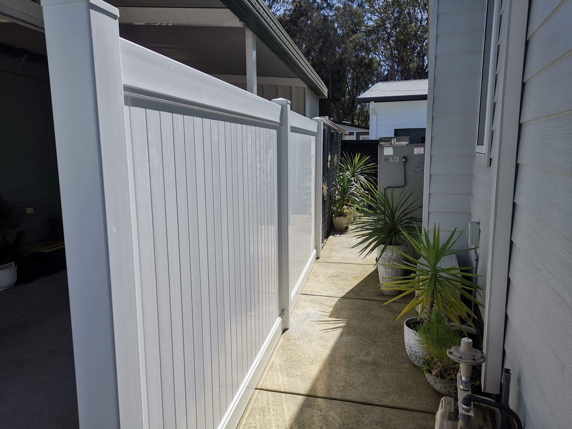 A White House With a Fence and Trees in Front of It — WeFence in Lisarow, NSW
