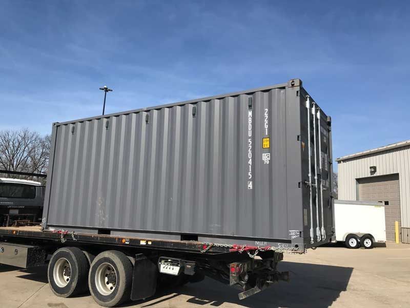 A large container on a trailer — Columbia, MO — Midway Hauling Containers & Roll-Offs