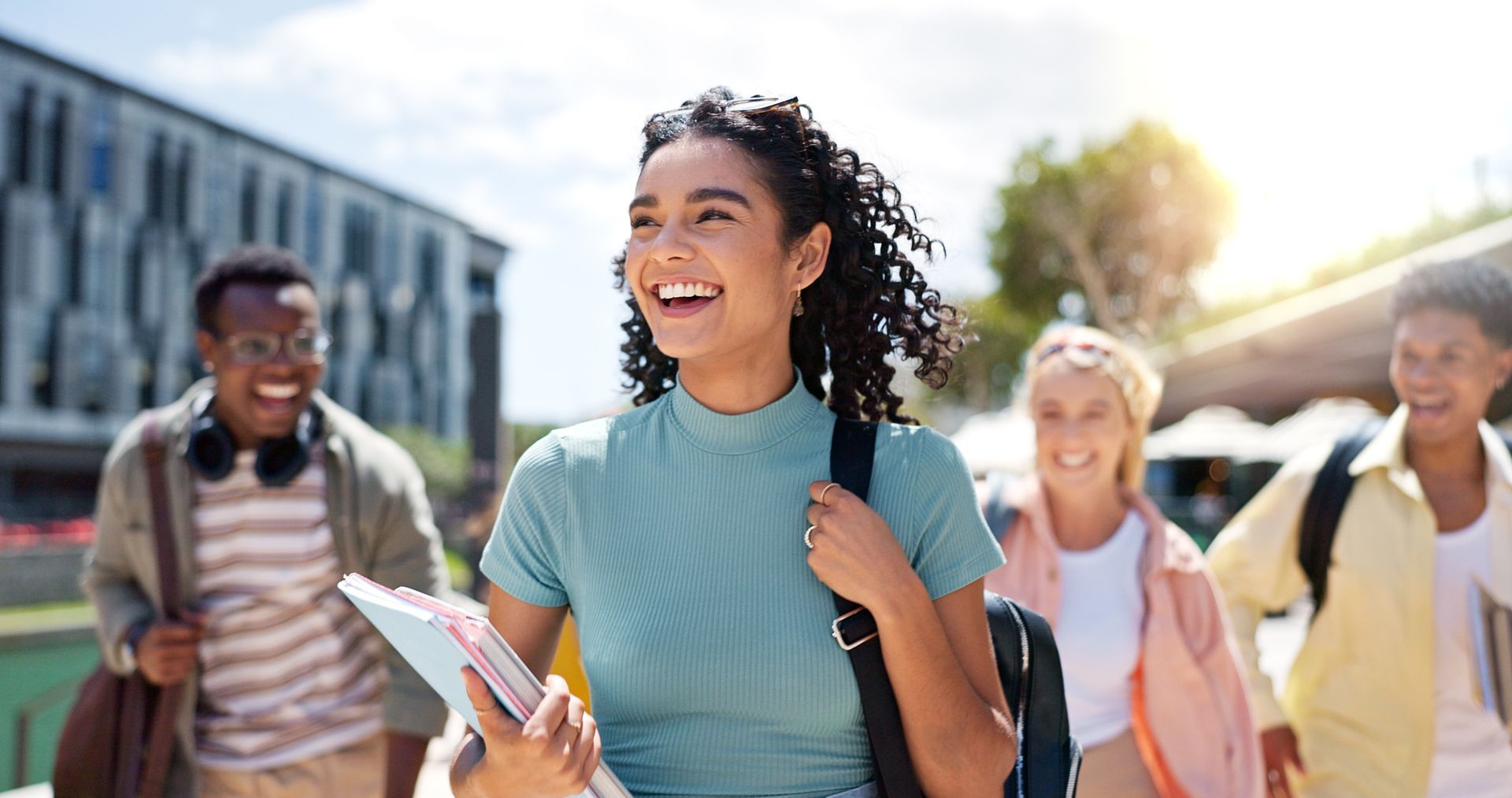 A group of young people are walking down a street.