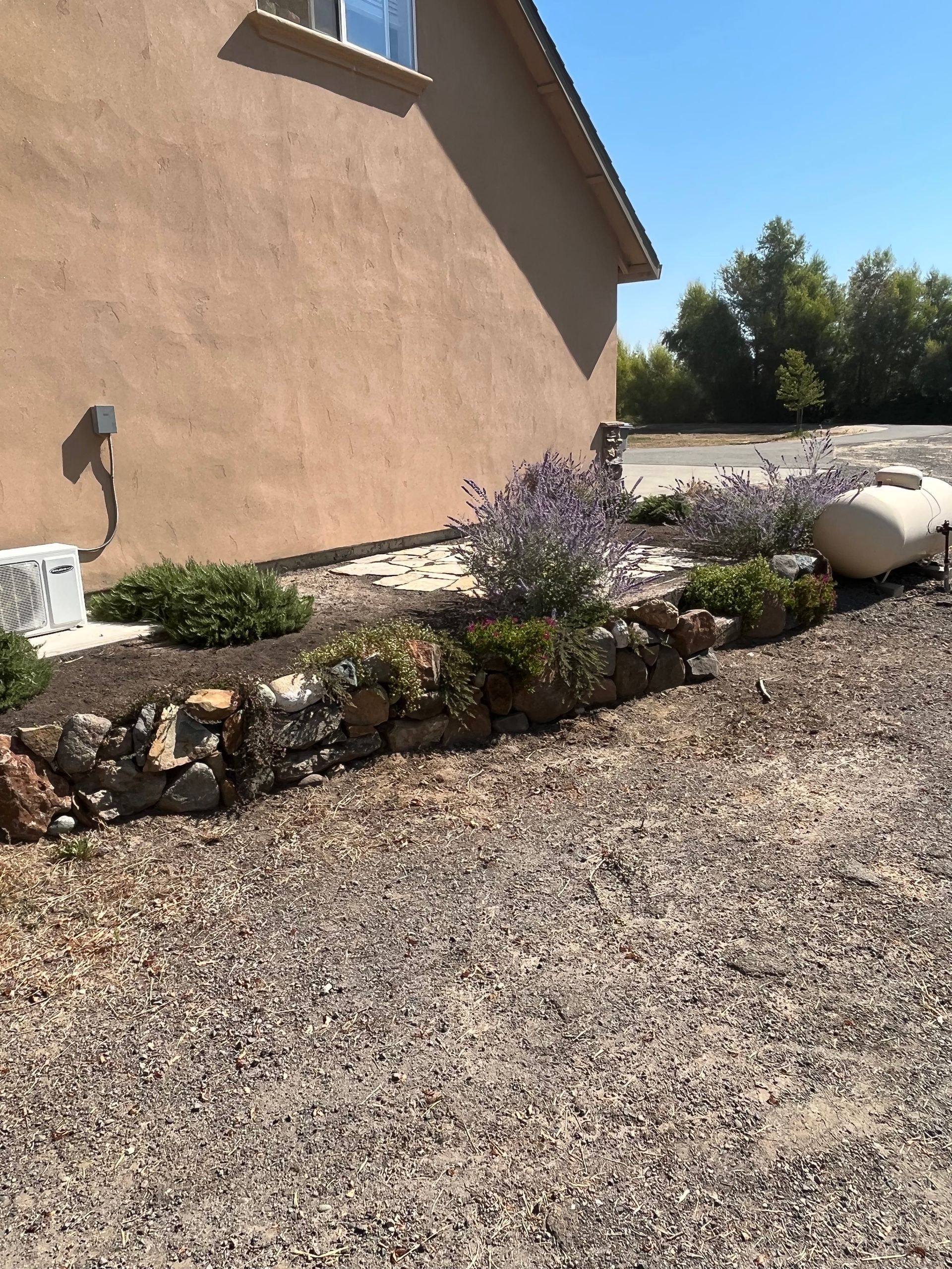 A house with a propane tank in front of it