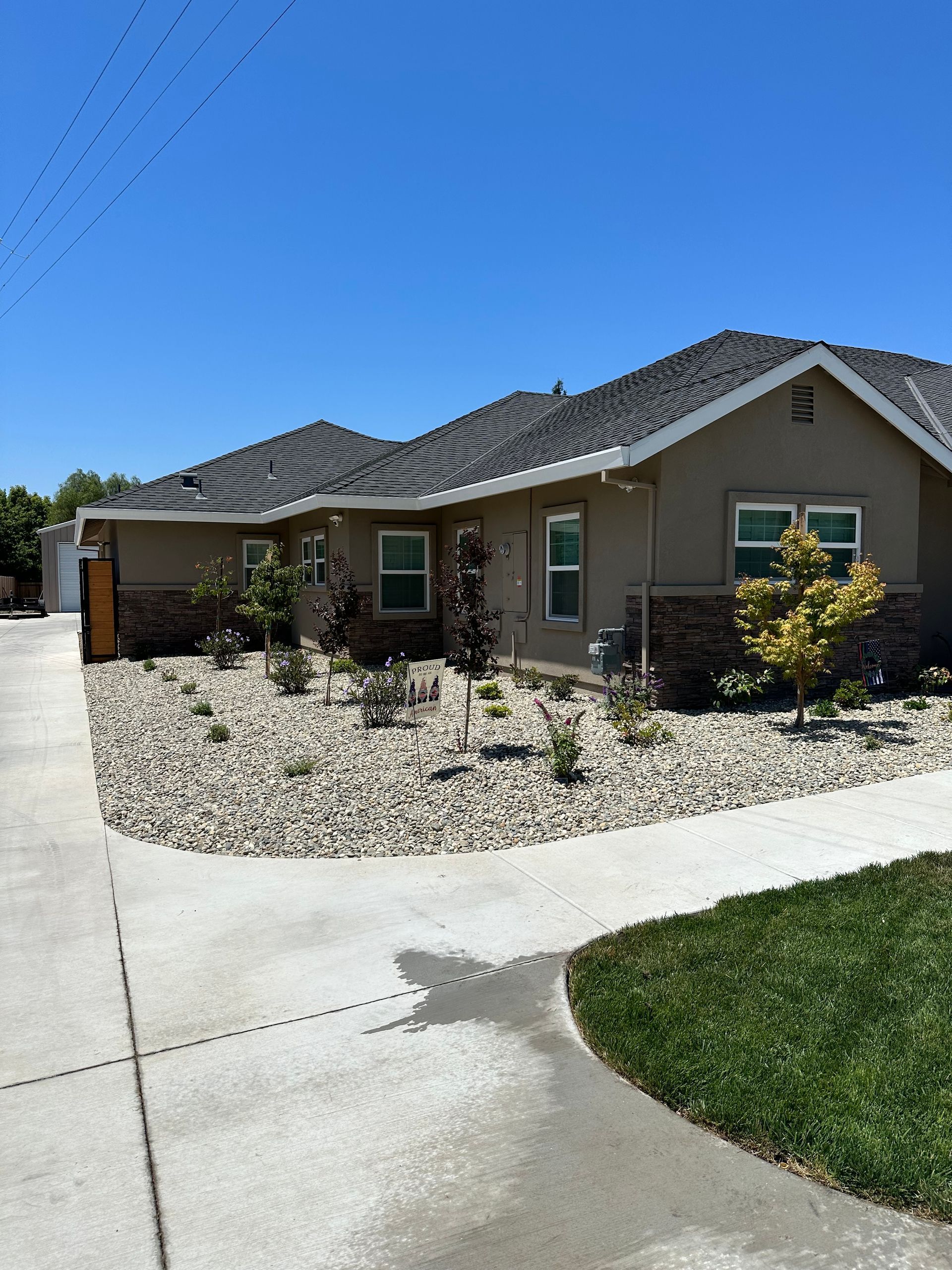 A house with a concrete walkway leading to it