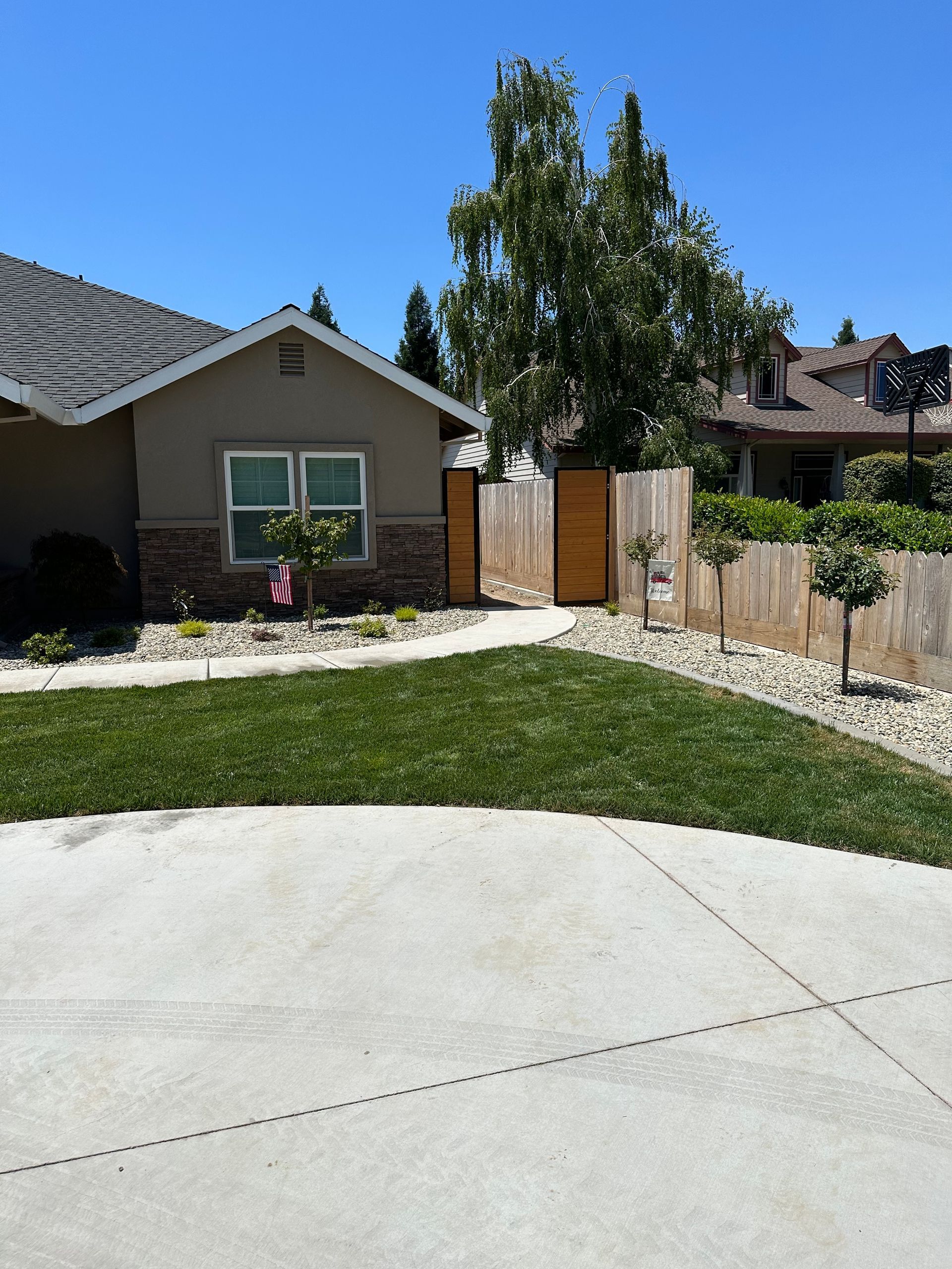 A house with a concrete driveway leading to it
