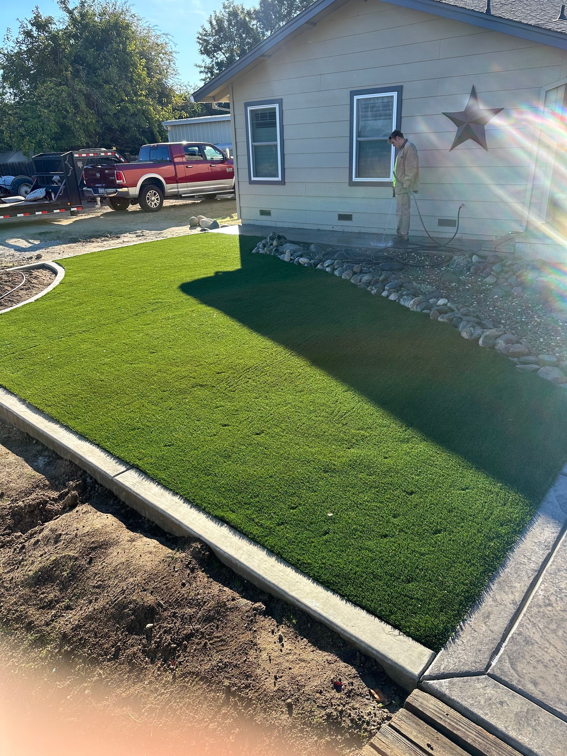A house with a lot of grass in front of it.