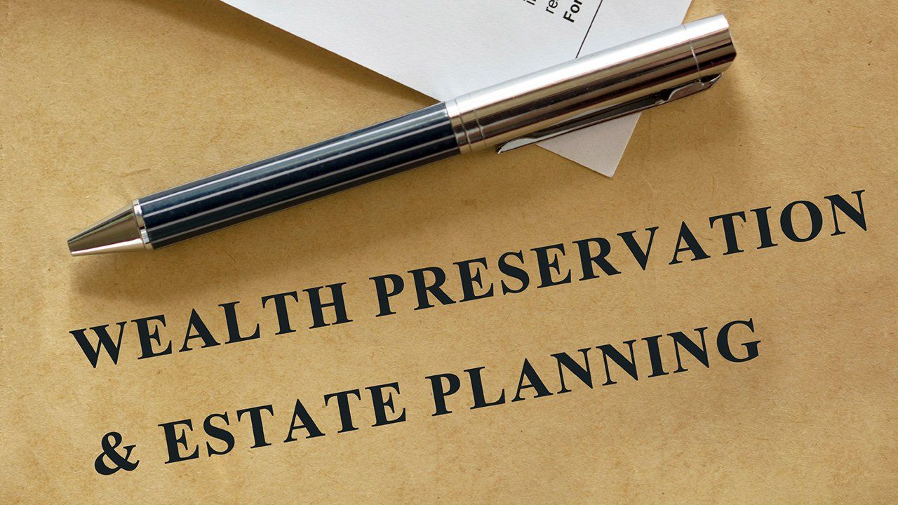 pen laying over text about estate planning
