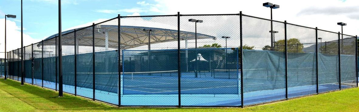 Tennis Court Enclosed in a  Fence — Fences in Bentley Park, QLD