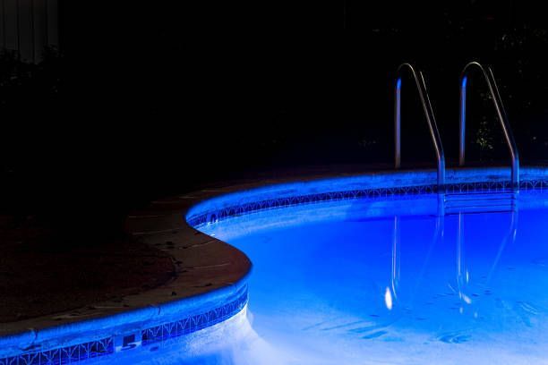 Outdoor pool detail with blue lighting, serviced by Pool Heater Repair Company