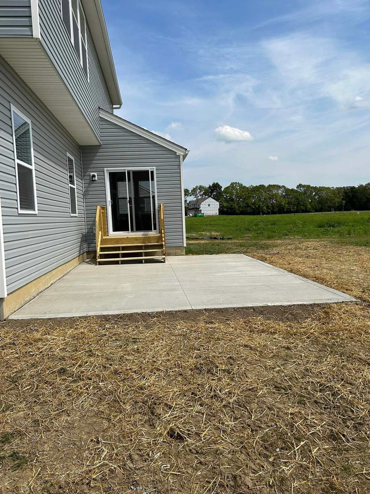 A House With A Concrete Patio In Front Of It — Chesterton, IN — Claycor Construction