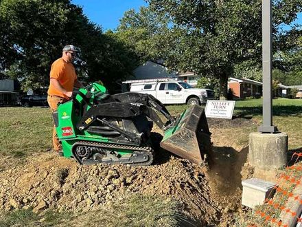 A Man Using A Tractor — Chesterton, IN — Claycor Construction
