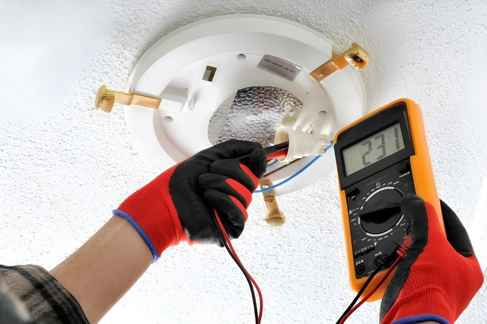 A Person is Using a Multimeter to Test a Light Bulb — Clifford Electrical in Ballina, NSW