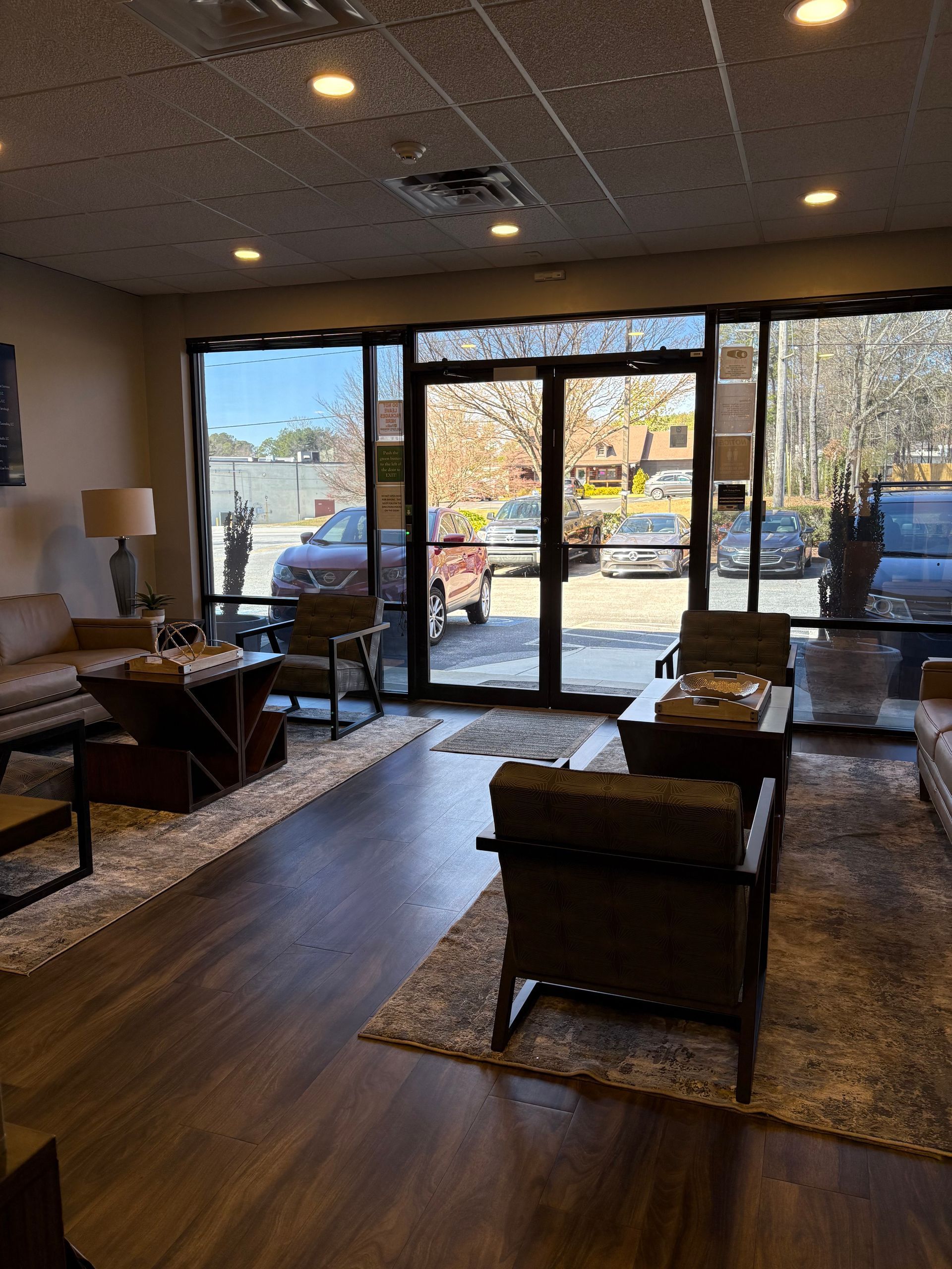 A living room with a lot of furniture and a large window.