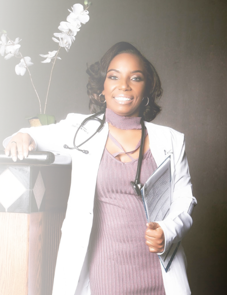 A woman in a lab coat with a stethoscope around her neck