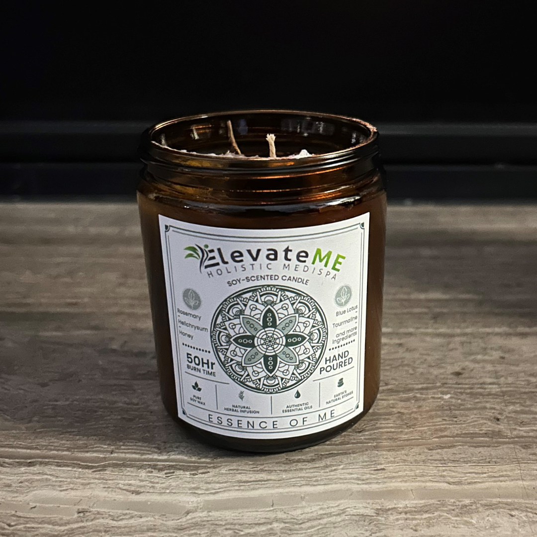 A candle in a jar with a label on it on a white background.