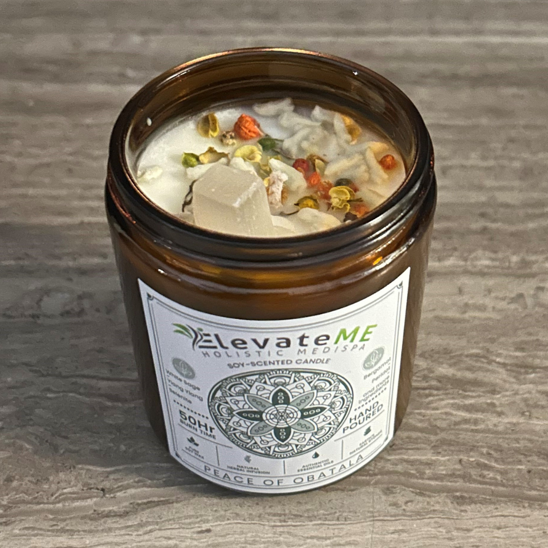 A candle in a glass jar with a label on it.