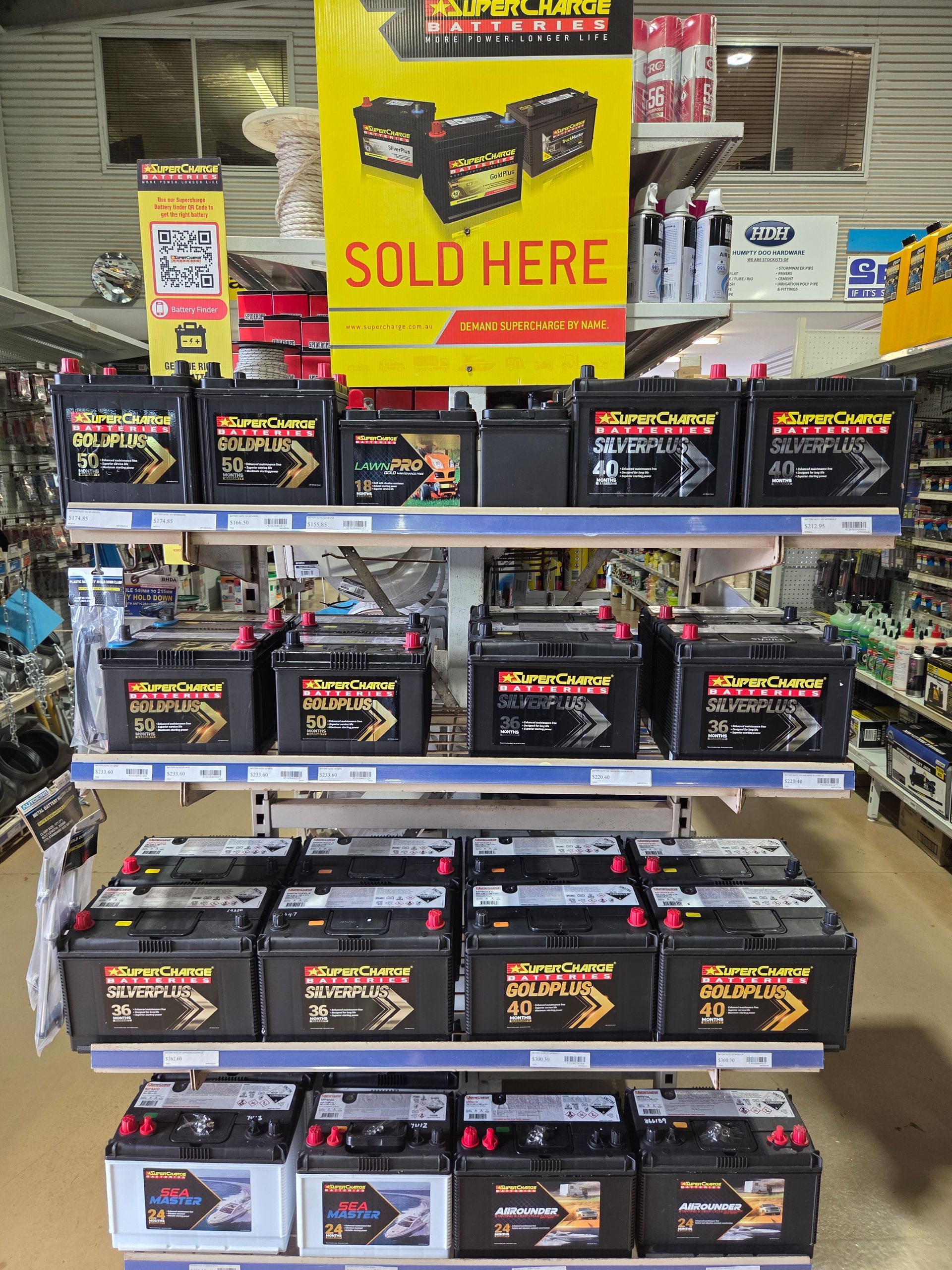 A Store Display Shelf Featuring Rows of Supercharge Batteries — Humpty Doo Hardware in Humpty Doo, NT