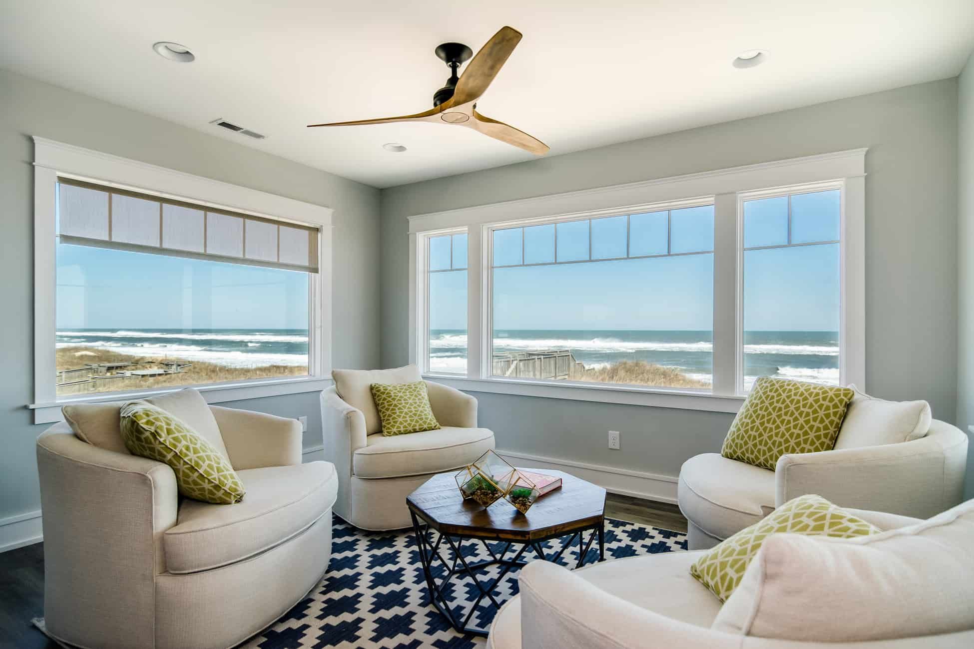 A dining room with a round table and chairs.