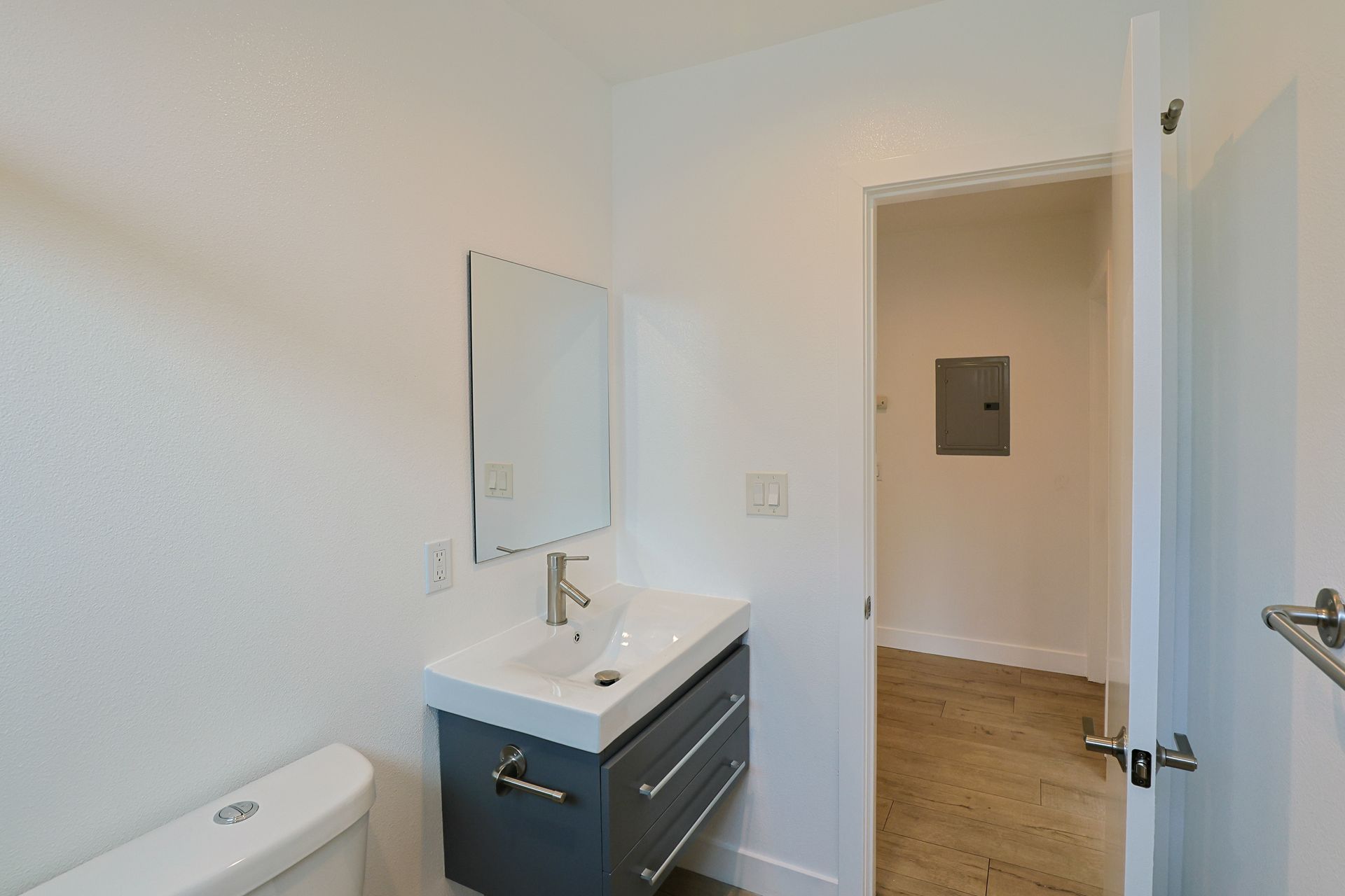 This image showing a tiny washroom with necessory accessories in it.